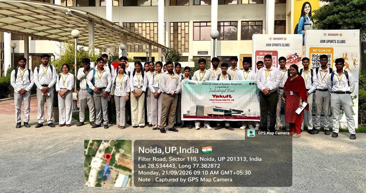 Students holding the Industrial Visit banner outside the MUIT Noida campus before departure